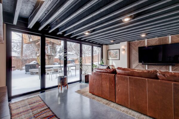 Eclectic Basement Remodel | Living Space, TV Wall, Open Beam Ceilings | FBC Remodel
